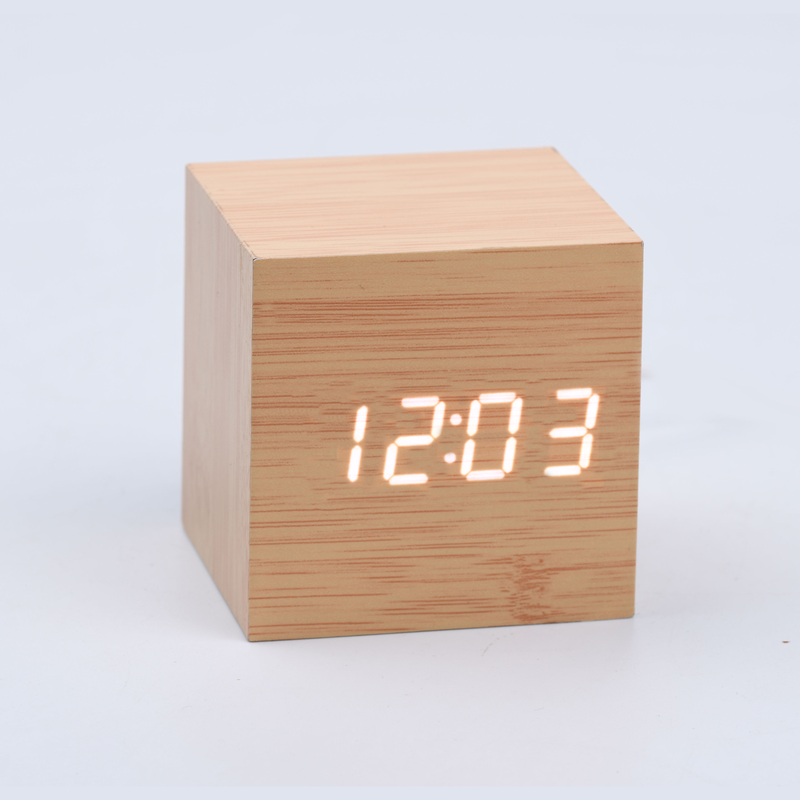 Cubee Wood clock in Natrual wood finish with digital time in white. Sound activated time for nightime lighting.