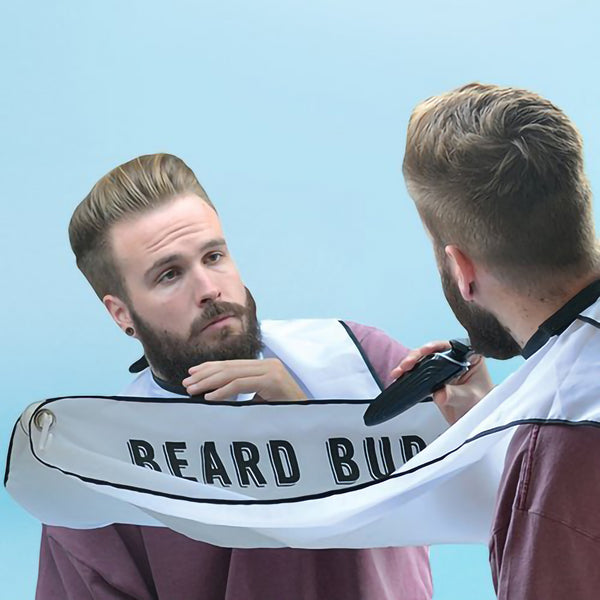 Beard Buddy Shaving Bib in use, connected to your mirror with suction cups, great gift for men with beards.