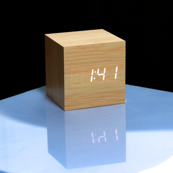 Cubee Wood clock in Natrual wood finish with digital time in white. Sound activated time for bed time lighting.