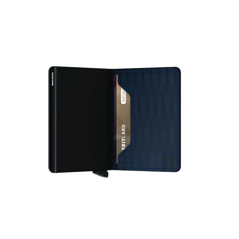The classic herringbone pattern of the Secrid Slimwallet Dash Navy got reimagined for a present day wallet. This leather is embossed consecutively for a textured look and feel but still keeping your banknotes and credit cards safe with the built-in aluminium case card holder.